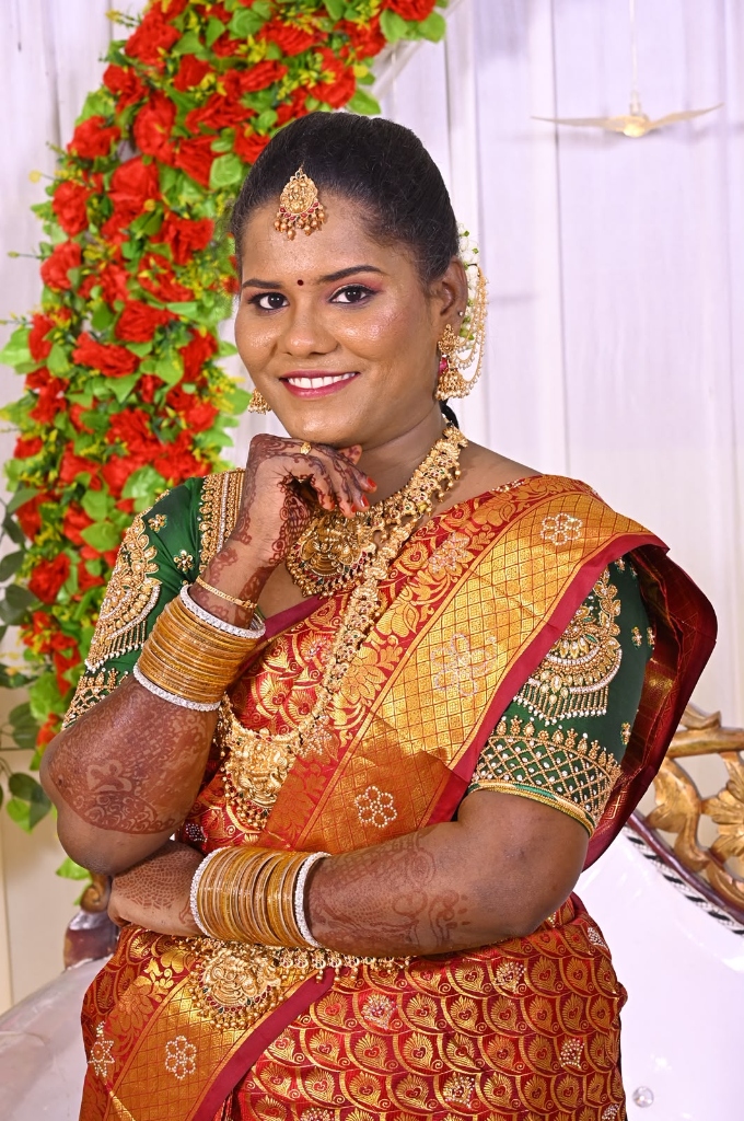 Red Silk Saree Bride with Rose Arch Backdrop